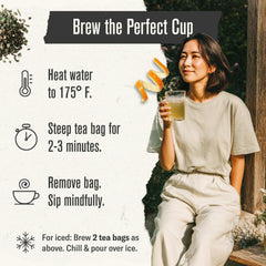 Numi tea steeping in glass cup showing warm roasted color and smooth finish