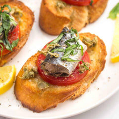 Nuri open can top view with whole sardines in oil, highlights ready-to-eat appeal