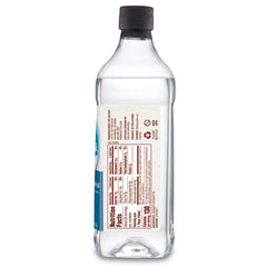 Nutiva pouring liquid coconut oil from bottle for easy measuring benefit