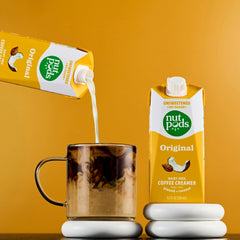 nutpods being poured into brewed coffee enhancing taste and creaminess