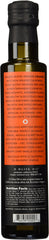 O Olive oil pour close-up showing texture and vibrant color for finishing dishes