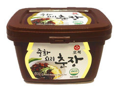 OBOK paste in a skillet being stir-fried with vegetables demonstrating quick sauce creation