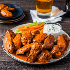 platter of shrimp drizzled with OLD BAY Hot Sauce, highlighting enhanced seafood flavor