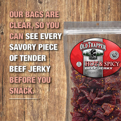 Old Trapper held in hand demonstrating portable snack convenience and protein boost
