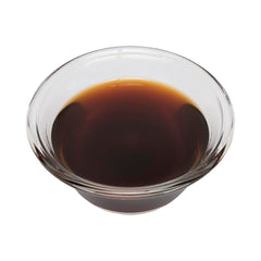 OLIVENATION black walnut dropper dispensing drops into batter to boost nutty flavor