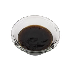 OliveNation being stirred into frosting showing even flavor distribution and visual appeal