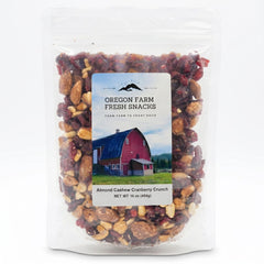 OREGON FARM FRESH SNACKS contents close-up displaying mixed nuts and cranberries, emphasizes texture
