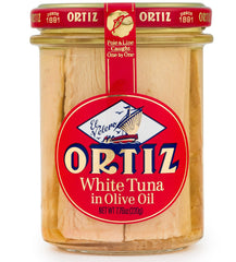 Ortiz jar front view showing clear glass and olive oil, highlights premium presentation