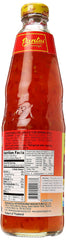 Pantai bottle beside a plate of spring rolls showing serving suggestion and flavor boost