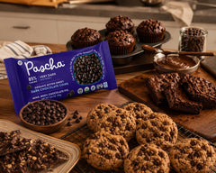 Freshly baked cookies studded with Pascha chips showcasing bold dark chocolate flavor