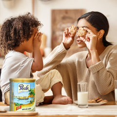 Peak glass of reconstituted milk showing creamy pour and freshness