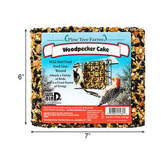 Pine Tree Farms seed cake hanging from a tree branch attracting perched birds for natural feeding