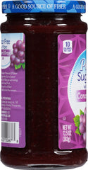 Polaner jar open with spoon lifting jam, demonstrating spreadability and convenience