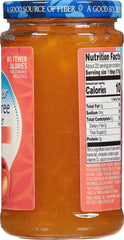 Slice of toast spread with Polaner peach jam showing bright fruit flavor