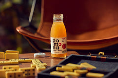 Pomona Organic Apple Juice glass bottle close-up highlighting cold-pressed clarity