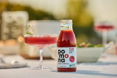 Pomona Organic Juices poured into glass demonstrating ready-to-drink freshness