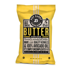 POP DADDY ·POPCORN· open bag with golden popped kernels highlighting fresh crunch