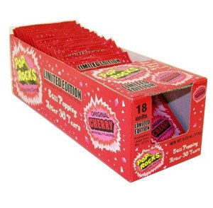 Pop Rocks cherry front packet close-up showing bright red packaging and playful popping benefit