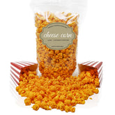 Pop'N Popcorn front packaging showing 12 oz bag and cheesy popcorn inside, fresh appeal