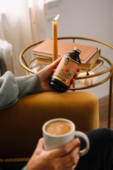 Barista pouring Portland Syrups into a latte to add warm autumn flavor