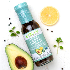 Primal Kitchen Greek Dressing marinating chicken to add savory Mediterranean flavor benefit