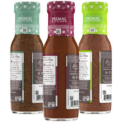 Primal Kitchen Italian Dressing bottle close-up highlighting herb specks and fresh flavor benefit