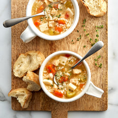 Close-up of soup ingredients in can highlighting chicken, rice, and vegetables for ingredient clarity