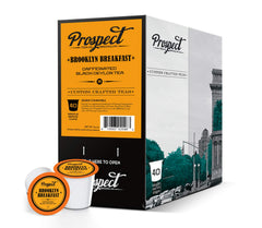 Scattered Prospect Tea Co. pods on countertop highlighting easy single-serve use