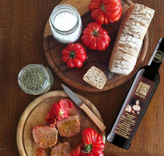 Pruneti oil drizzled for bread dipping delivering rich green taste