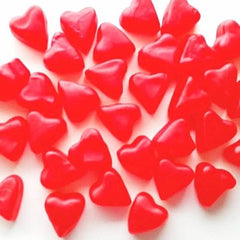 QUEEN CITY CANDY CAVE top view scatter of red heart gummies for eye-catching displays