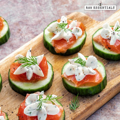 Raw Essentials sprinkled on popcorn illustrating bold dill pickle taste for snacks