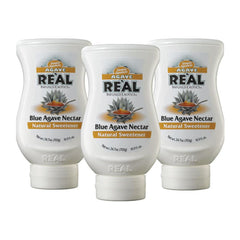 Reàl Infused Exotics front packaging showing three bottles and label benefits