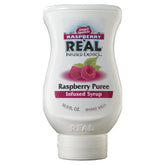 Reàl Infused Exotics bottle front view showing raspberry syrup and elegant label