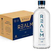 REALM Artesian Water front packaging showing 12-pack glass bottles and premium branding