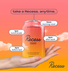 Recess can beside fresh grapefruit and tangerine showing natural juice flavor