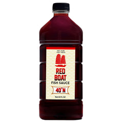 Red Boat front label on 64 fl oz bottle showing brand and clarity benefits