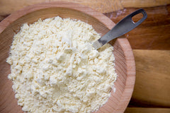 Relative Foods millet flour in bowl with spoon showing mixing convenience