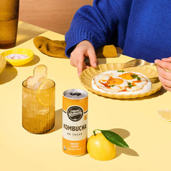 Remedy open can with visible bubbles illustrating light carbonation and crisp taste