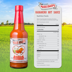 Rex Marie Sharp poured over tacos adding bright heat and citrus balance to food