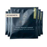 Rishi Tea front packaging showing Yuzu Peach Green 50-count sachets and organic seal, clear labeling benefit