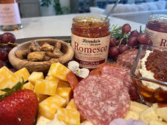 Ronda's Fine Foods almonds peppers and tomatoes flatlay showing fresh ingredient quality