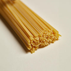 Rummo durum wheat semolina beside pasta indicating premium ingredients