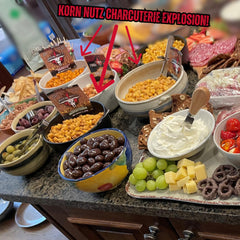 RunninWild pouring BBQ Korn Nutz from an open bag to bowl, ready to share