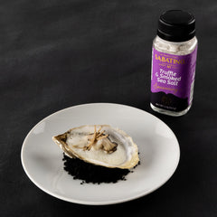 Sabatino Tartufi sprinkling smoked truffle salt on steak adds savory depth