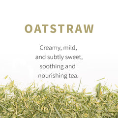 Sacred Blossom Farm oatstraw steeping in a glass cup, clear infusion