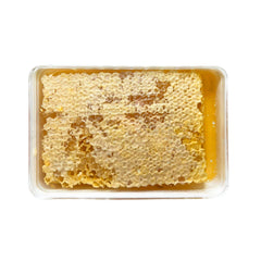 Sanniti Fulmer honey dripping from comb showing smooth pourability