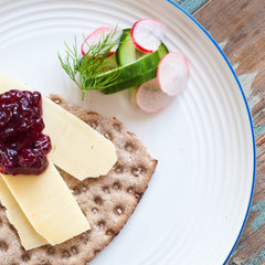 Sanniti lingonberries served beside Swedish meatballs on plate adding bright acidity