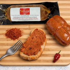 Open Sanniti jar with knife spreading nduja for quick serving