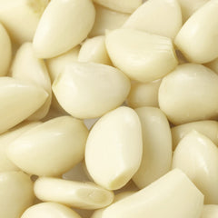 Close-up of Sanniti garlic clove texture highlighting tender, pickled bite for flavor