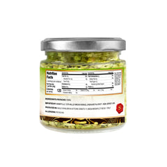 Sanniti pistachio on spoon showing fine texture for easy sprinkling benefit